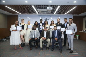 GIA Graduate Diamond Diploma Program students with their certificates L-to-R (seated): GIA India Instructor; Akshay Shah, Director Sales, Large Size Solitaire Category, Dharmanandan Diamonds Pvt. Ltd. and Apoorva Deshingkar, Senior Director – Education and Market Development, GIA India